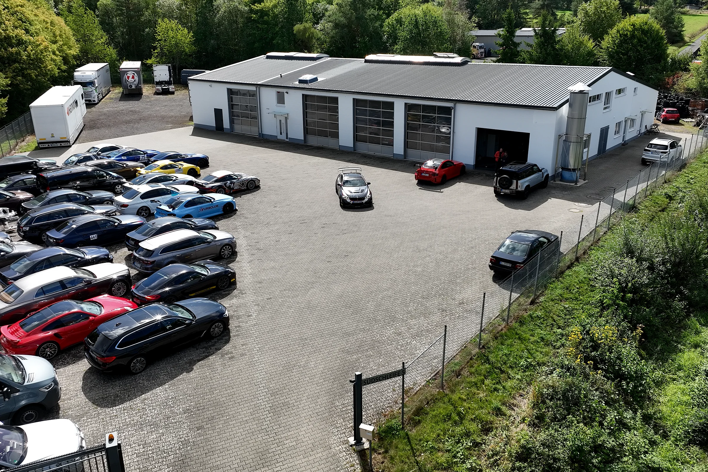 Aerial view of the GTM location in Müllenbach, with P01 in front of the workshop